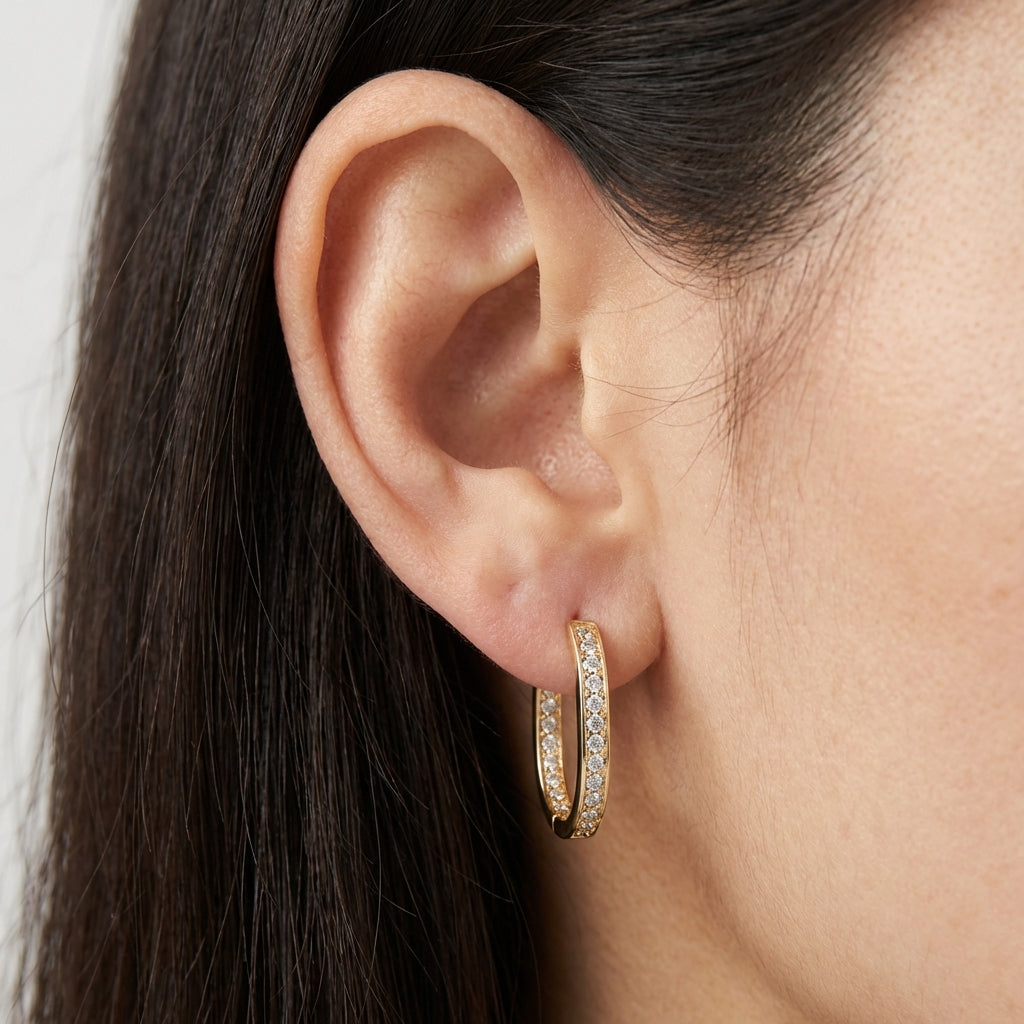 Model wearing gold earrings showing scale