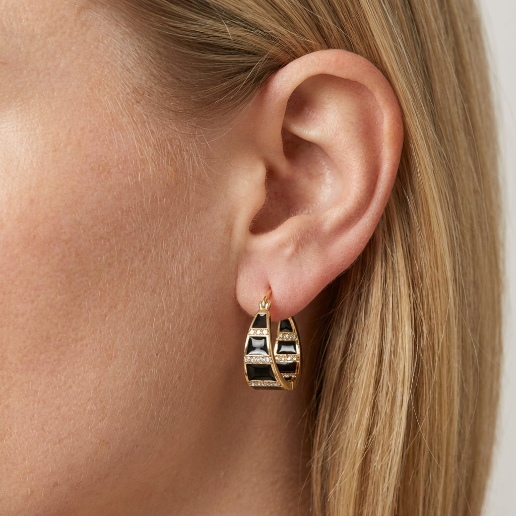 Model wearing gold hoop earrings showing scale