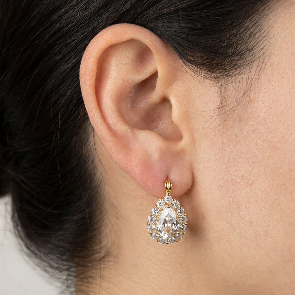 Model wearing gold hoop earrings showing scale